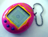 Un tamagotchi de couleur rose