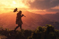 Un homme primitif marchant sur une colline